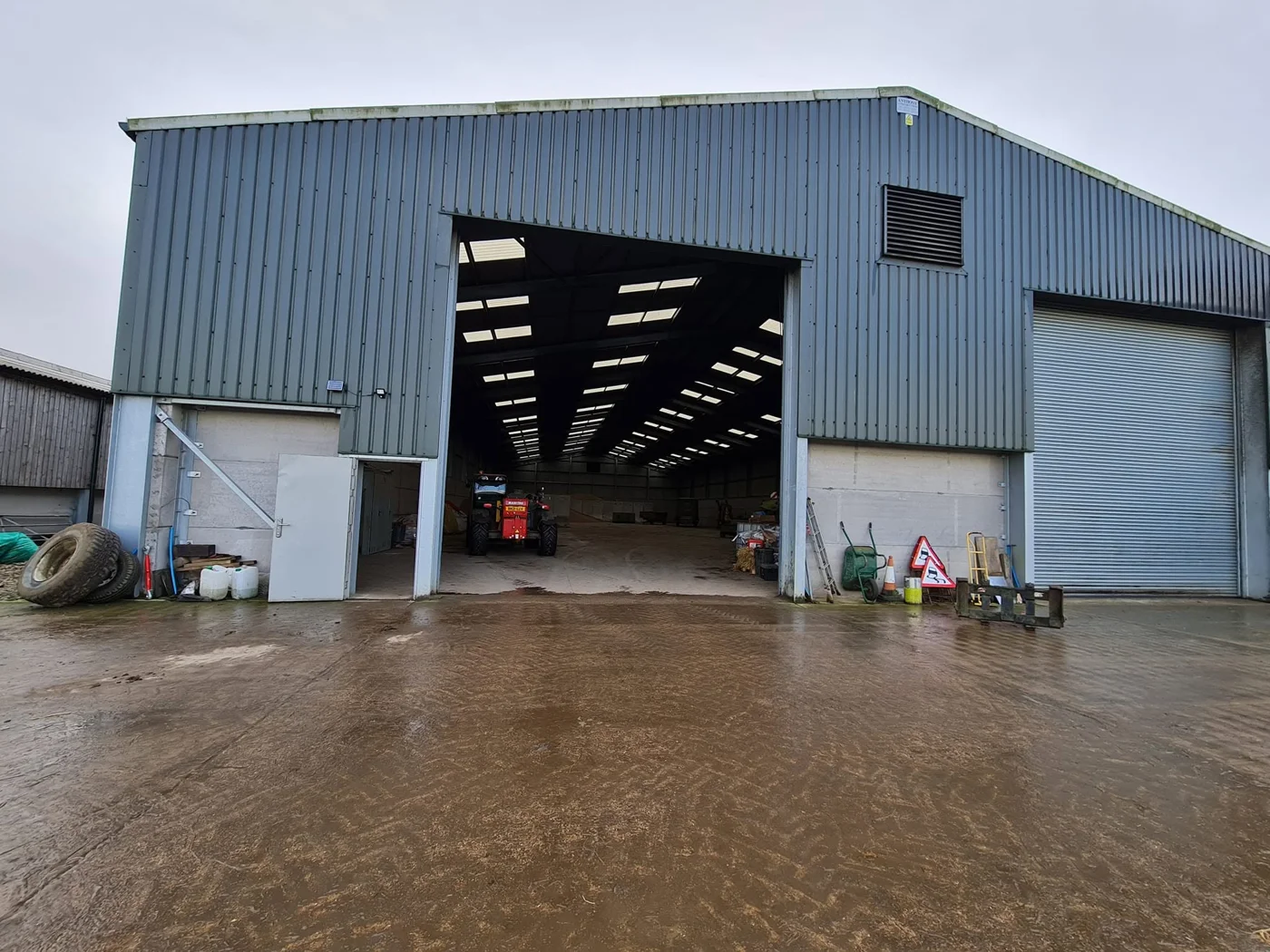 Agricultural building with cameras mounted on its exterior