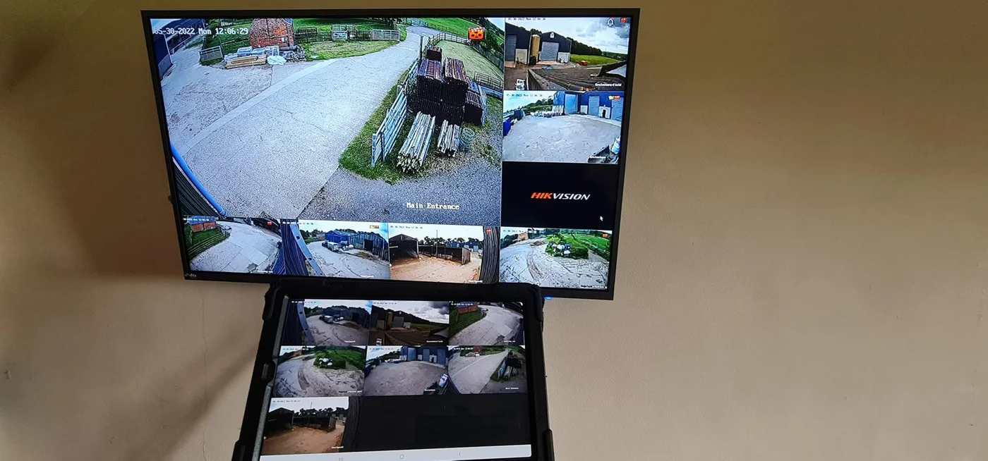 Monitor and tablet displaying multiple farm CCTV views