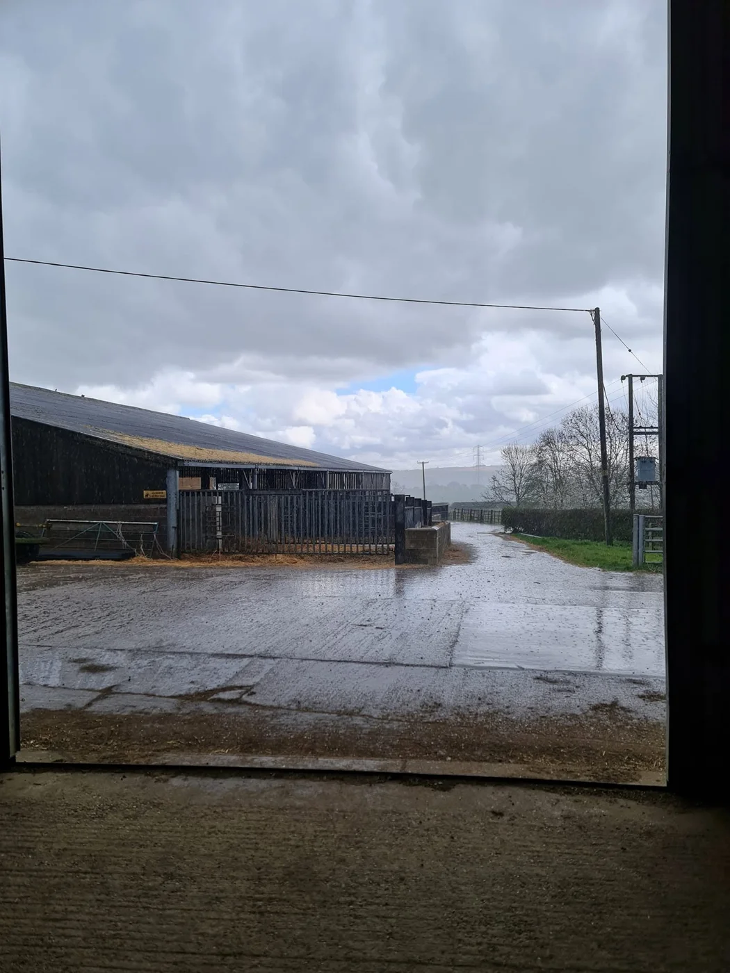 Farm yard with livestock buildings and an entrance